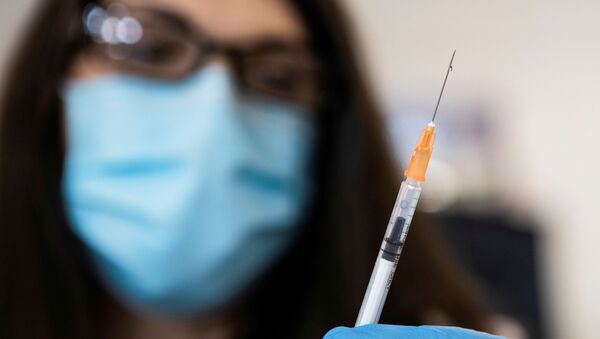 Nurse Nicole McCurrach, 48, draws up coronavirus disease (COVID-19) vaccinations at Richmond raceway in Richmond, Virginia, U.S., March 4, 2021 - Sputnik International