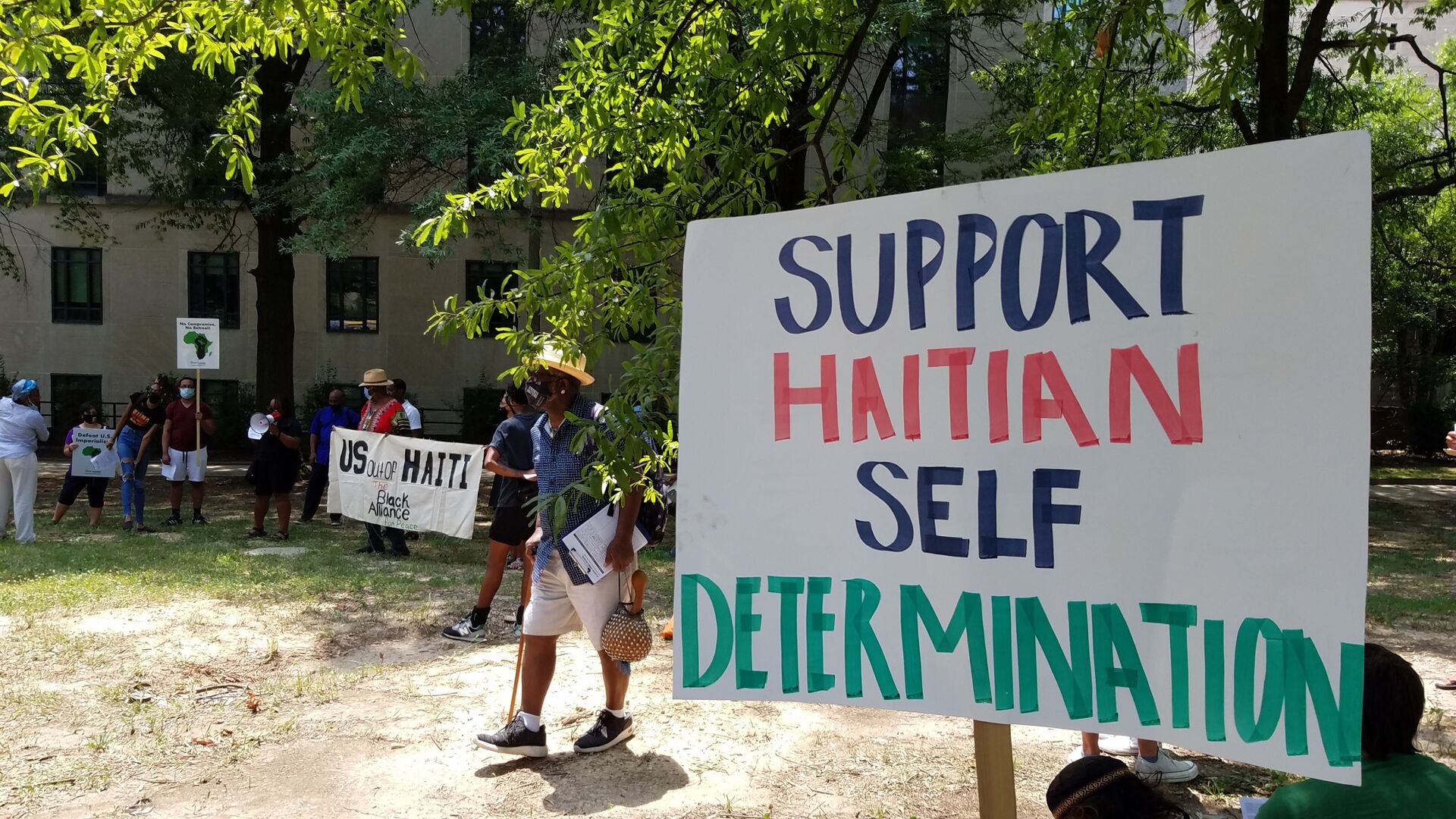 Activists rally outside the US State Department against US involvement in Haiti, including the potential deployment of US troops after the assassination of Haitian President Jovenel Moise - Sputnik International, 1920, 15.07.2021