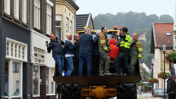 People are evacuated from a flood-affected area, following heavy rainfalls in Valkenburg, Netherlands, July 15, 2021.  - Sputnik International