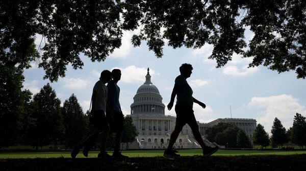 Visitors walk the grounds of the U.S. Capitol, days after the removal of security fencing which was placed around the complex after the January 6th attack, in Washington, U.S., July 12, 2021. - Sputnik International