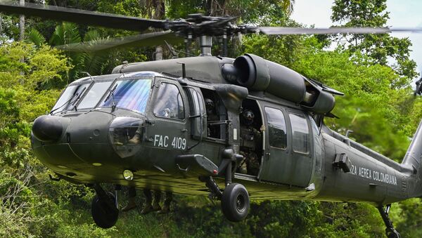 A Colombian Air Force helicopter prepares to land to exfiltrate Colombian soldiers during the Relampago VI Exercise near Palenquero Air Base, Colombia, July 12, 2021. - Sputnik International