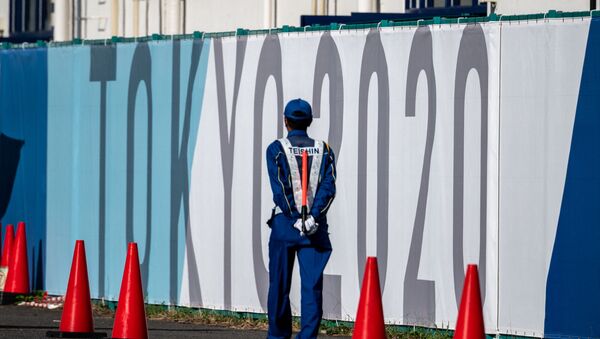 A security guard walks at the Olympic and Paralympic Village in Tokyo on July 15, 2021, ahead of the 2020 Tokyo Olympic Games which begins on July 23. - Sputnik International