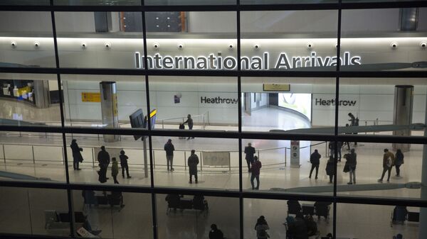 n this file photo dated Tuesday, Jan. 26, 2021, people in the arrivals area at Heathrow Airport in London, during England's coronavirus lockdown - Sputnik International