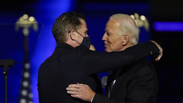 President-elect Joe Biden hugs his son Hunter Biden on stage, Saturday, 7 November 2020, in Wilmington, Delaware - Sputnik International