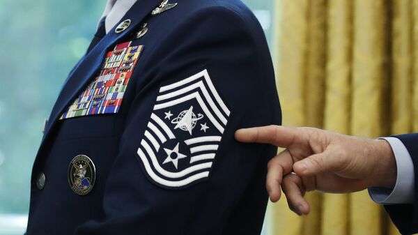  In this May 15, 2020, file photo, Chief Master Sgt. Roger Towberman displays his insignia during a presentation of the United States Space Force flag in the Oval Office of the White House in Washington - Sputnik International