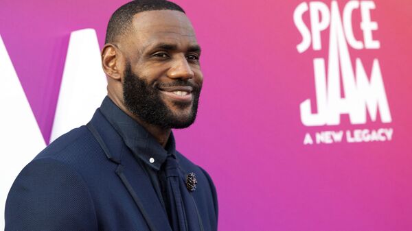 In this file photo basketball player/actor LeBron James arrives at the Warner Bros Pictures world premiere of Space Jam: A New Legacy at the Regal LA Live in Los Angeles, California, July 12, 2021. - New Warner Bros. release Space Jam: A New Legacy rocketed to the top of the North American box office over the weekend, taking in an estimated $31.6 million in the best showing of a family film since Covid first hammered the industry. The live action/animated movie -- a sequel nearly 25 years after the original Space Jam with Michael Jordan -- has NBA superstar LeBron James teaming up with Bugs Bunny and other Looney Tunes characters in a high-stakes basketball game against a rogue artificial-intelligence entity threatening his son. - Sputnik International