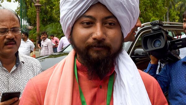 Newly elected Member of Parliament, Nisith Pramanik, looks on as he arrives to attend the first session of the Indian parliament in New Delhi on June 17, 2019 - Sputnik International