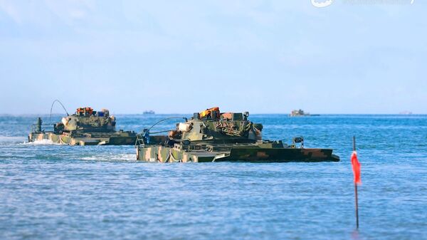 Amphibious armored infantry fighting vehicles (IFV) attached to a brigade under the PLA 72nd Group Army drive into the waters during an amphibious training exercise focused on subjects of basic driving, landing craft ferrying and assault wave formation, etc. on May 21, 2021 - Sputnik International