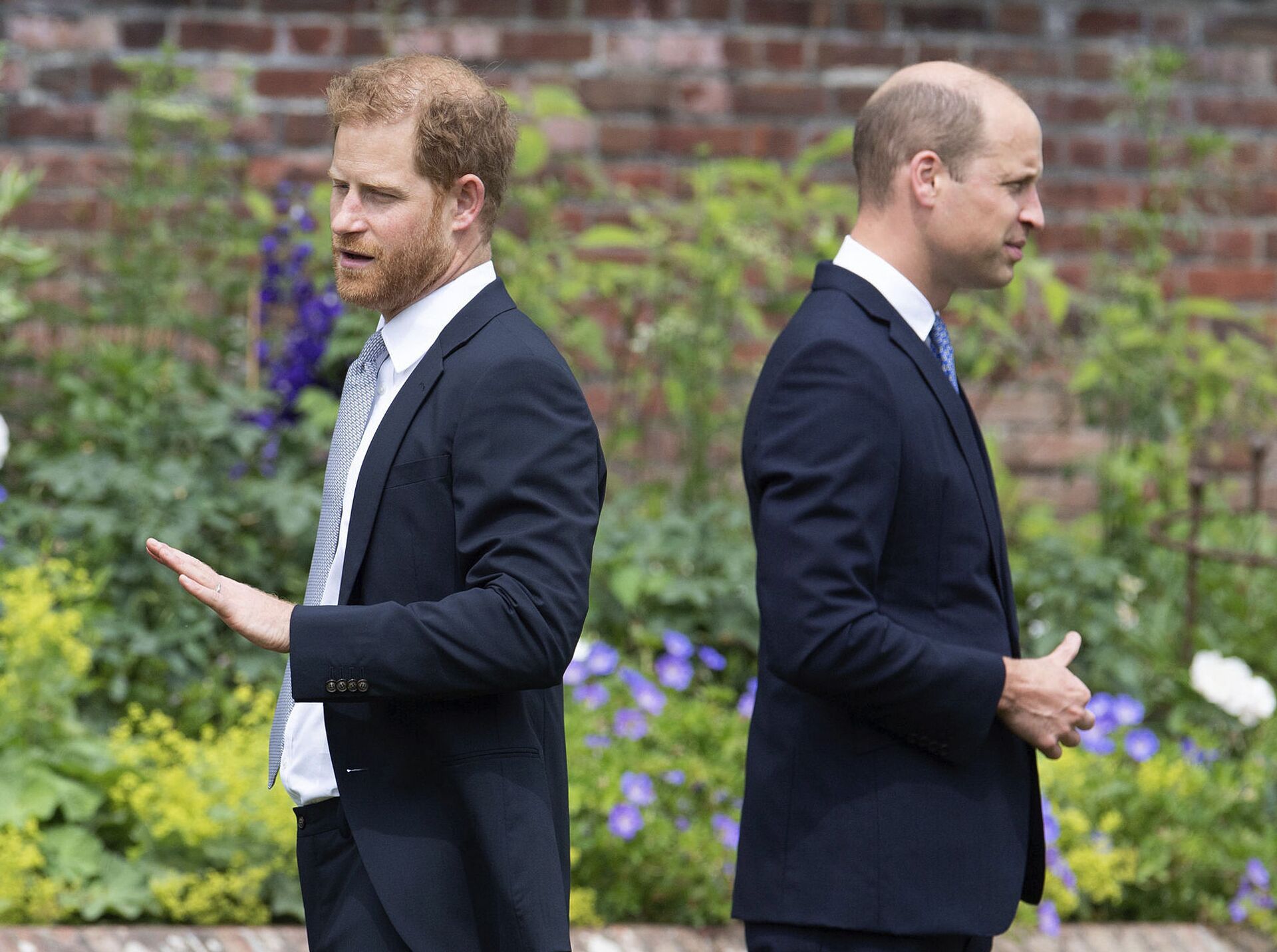Prince Harry, left, and Prince William stand together during the unveiling of a statue they commissioned of their mother Princess Diana, on what woud have been her 60th birthday, in the Sunken Garden at Kensington Palace, London, Thursday July 1, 2021 - Sputnik International, 1920, 07.09.2021