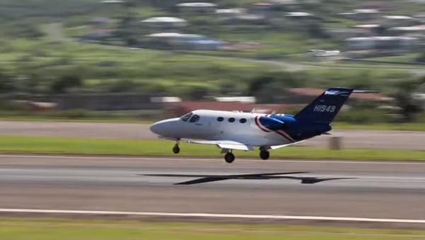 Cessna Citation Mustang HI949, owned by Helidosa in the Dominican Republic, landing on St. Kitts in 2014 - Sputnik International