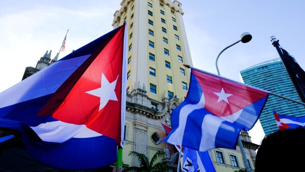 Emigres wave Cuban flags at the Freedom Tower in reaction to reports of protests in Cuba against its deteriorating economy, in Miami, Florida, U.S. July 17, 2021 - Sputnik International