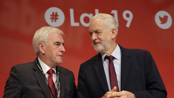 Jeremy Corbyn, leader of Britain's opposition Labour Party, right, and John McDonnell Shadow Chancellor on stage during the Labour Party Conference at the Brighton Centre , Tuesday, Sept. 24, 2019. - Sputnik International