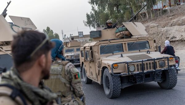 A convoy of Afghan Special Forces is seen during the rescue mission of a police officer besieged at a check post surrounded by Taliban, in Kandahar province, Afghanistan, July 13, 2021. REUTERS/Danish Siddiqui - Sputnik International