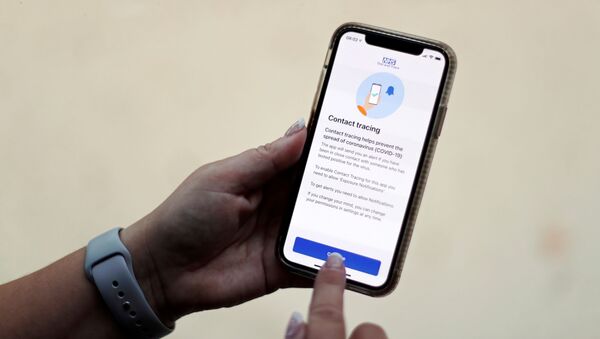 FILE PHOTO: The coronavirus disease (COVID-19) contact tracing smartphone app of Britain's National Health Service (NHS) is displayed on an iPhone in this illustration photograph taken in Keele, Britain, September 24, 2020.  - Sputnik International