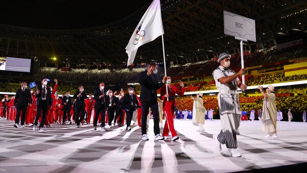 Tokyo 2020 Olympics - The Tokyo 2020 Olympics Opening Ceremony - Olympic Stadium, Tokyo, Japan - July 23, 2021. Flag bearer Sofya Velikaya of the Russian Olympic Committee leads her contingent during the athletes' parade at the opening ceremony - Sputnik International