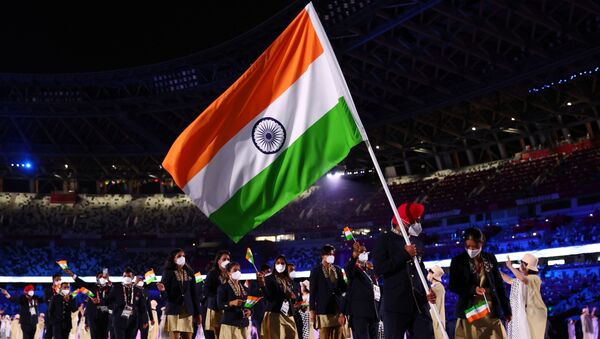 Tokyo 2020 Olympics - The Tokyo 2020 Olympics Opening Ceremony - Olympic Stadium, Tokyo, Japan - July 23, 2021. Flag bearers Harmanpreet Singh of India and Mary Kom Hmangte of India lead their contingent during the athletes' parade at the opening ceremony REUTERS/Kai Pfaffenbach - Sputnik International