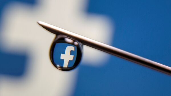 Facebook logo is reflected in a drop on a syringe needle in this illustration photo taken 16 March 2021 - Sputnik International