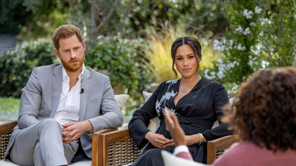 Britain's Prince Harry and Meghan, Duchess of Sussex, are interviewed by Oprah Winfrey in this undated handout photo. - Sputnik International
