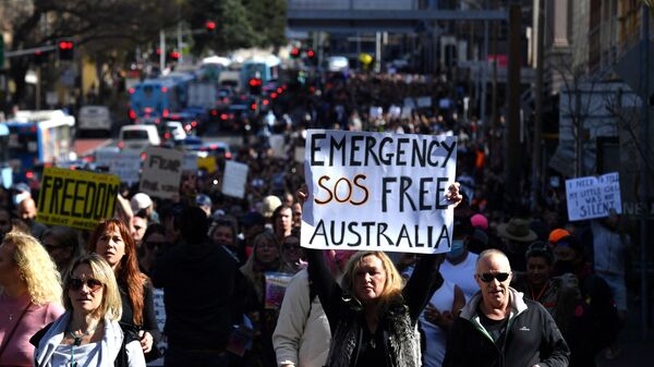 Protesters march through the city centre during an anti-lockdown rally as an outbreak of the coronavirus disease (COVID-19) affects Sydney, Australia, July 24, 2021. - Sputnik International