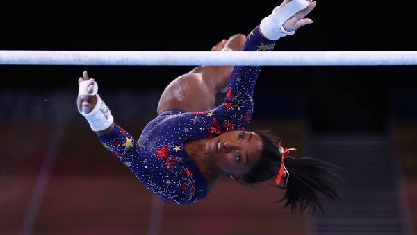 Tokyo 2020 Olympics - Gymnastics - Artistic - Women's Uneven Bars - Qualification - Ariake Gymnastics Centre, Tokyo, Japan - July 25, 2021. Simone Biles of the United States in action during the uneven bars REUTERS/Mike Blake/File photo  SEARCH OLYMPICS DAY 3 FOR TOKYO 2020 OLYMPICS EDITOR'S CHOICE, SEARCH REUTERS OLYMPICS TOPIX FOR ALL EDITOR'S CHOICE PICTURES. - Sputnik International