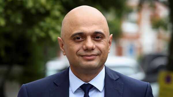 Britain's new Health Secretary Sajid Javid walks outside his home in London, Britain June 27, 2021. - Sputnik International