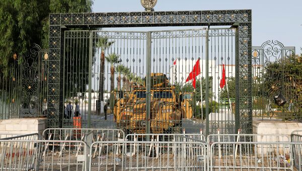 A military vehicle is pictured in front of the parliament building in Tunis, Tunisia  July 26, 2021. - Sputnik International