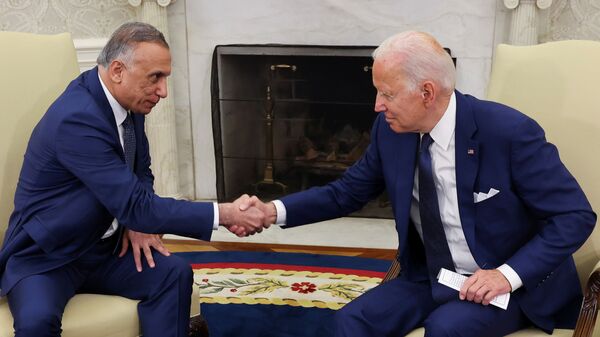 US President Joe Biden greets Iraq's Prime Minister Mustafa Al-Kadhimi during a bilateral meeting in the Oval Office at the White House in Washington, U.S., July 26, 2021 - Sputnik International