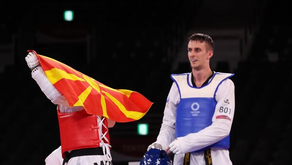Vladislav Larin of the Russian Olympic Committee and Dejan Georgievski of North Macedonia react after competing, Taekwondo, Men's Heavyweight +80kg. July 27, 2021 - Sputnik International
