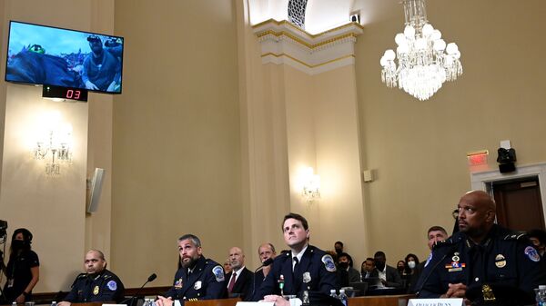 U.S. Capitol Police officer Sgt. Aquilino Gonell, DC Metropolitan Police Department officer Michael Fanone, DC Metropolitan Police Department officer Daniel Hodges and US Capitol Police officer Harry Dunn  watch a video of the Jan. 6 Attack during a hearing of the House select committee investigating the Jan. 6 attack, on the Capitol Hill, in Washington, U.S., July 27, 2021.  - Sputnik International