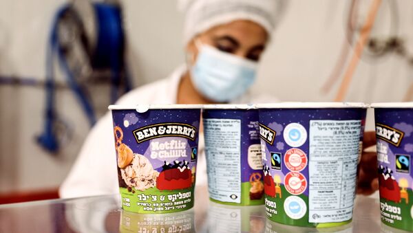 Tubs of ice-cream are seen as a labourer works at Ben & Jerry's factory in Be'er Tuvia, Israel July 20, 2021 - Sputnik International