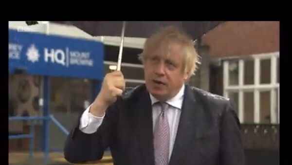 Boris Johnson and umbrella - Sputnik International