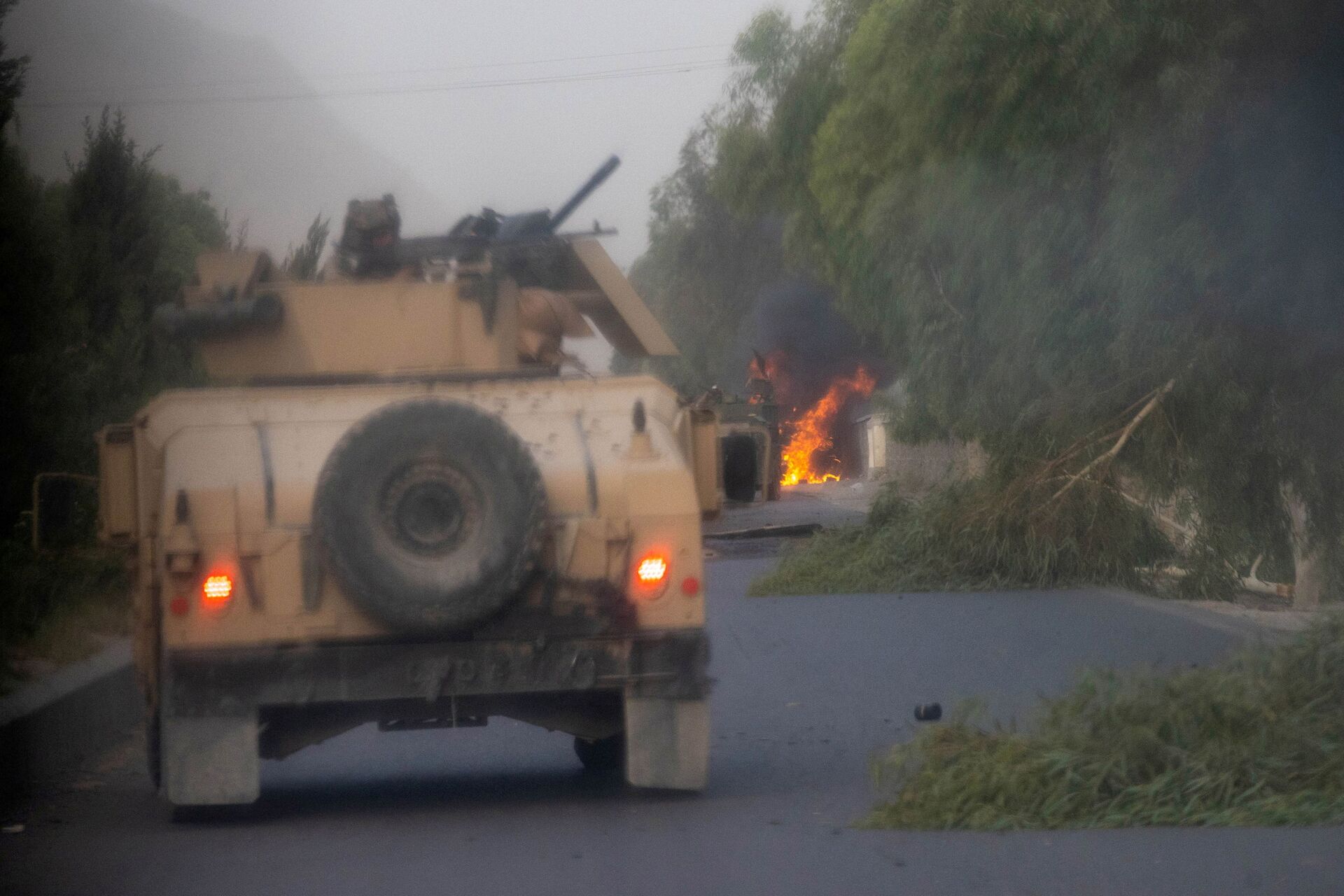 Humvees that belong to Afghan Special Forces are seen destroyed during heavy clashes with Taliban during the rescue mission of a police officer besieged at a check post, in Kandahar province, Afghanistan, July 13, 2021. - Sputnik International, 1920, 07.09.2021