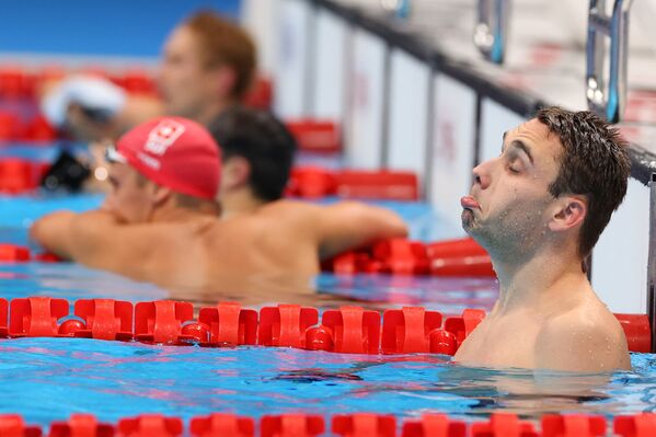 Swimmer Kristof Milak of Hungary reacts to his victory in the men's 200m butterfly semifinals at the Tokyo 2020 Olympics. - Sputnik International
