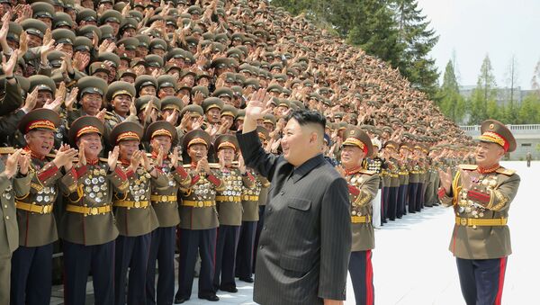 North Korea's leader Kim Jong Un greets participants of the first workshop of the commanders and political officers of the Korean People's Army (KPA) in Pyongyang, North Korea in this image supplied by North Korea's Korean Central News Agency on July 30, 2021.   - Sputnik International