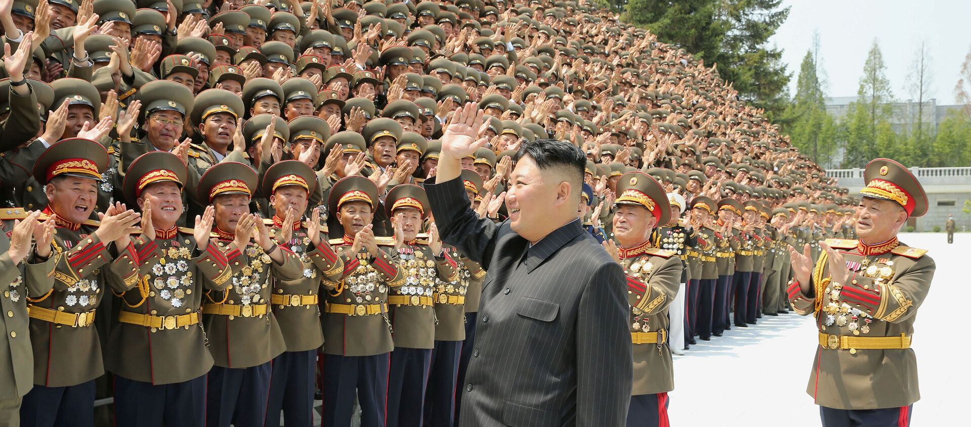 North Korea's leader Kim Jong Un greets participants of the first workshop of the commanders and political officers of the Korean People's Army (KPA) in Pyongyang, North Korea in this image supplied by North Korea's Korean Central News Agency on July 30, 2021.   - Sputnik International, 1920, 08.08.2021