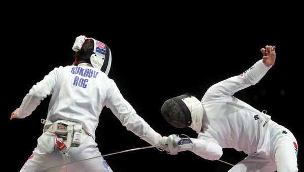 Tokyo 2020 Olympics - Fencing - Men's Team Epee - Gold medal match - Makuhari Messe Hall B - Chiba, Japan - July 30, 2021. Pavel Sukhov of the Russian Olympic Committee in action against Koki Kano of Japan REUTERS/Maxim Shemetov - Sputnik International