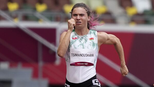 Kristina Timanovskaya, of Belarus, runs in the women's 100-meter run at the 2020 Summer Olympics, Friday, July 30, 2021.  - Sputnik International