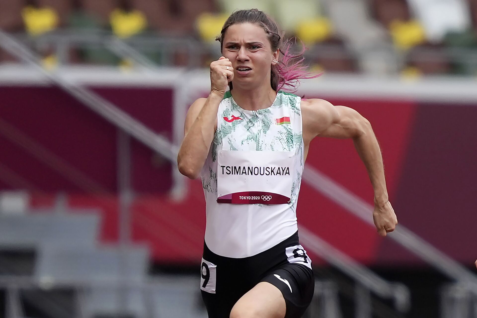 Kristina Timanovskaya, of Belarus, runs in the women's 100-meter run at the 2020 Summer Olympics, Friday, July 30, 2021.  - Sputnik International, 1920, 07.09.2021