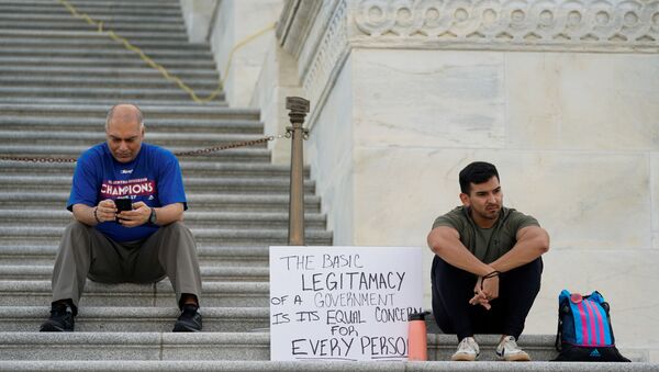 People gather on the House steps during a multi-day protest supporting an extension of the pandemic-related federal moratorium on residential evictions which has expired, outside the U.S. Capitol in Washington, U.S., August 1, 2021. - Sputnik International