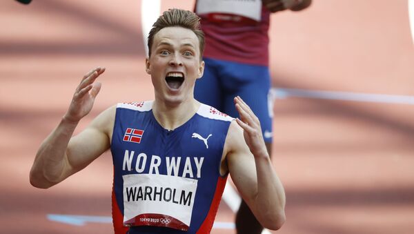 Karsten Warholm of Norway celebrates after winning gold and setting a new world record - Sputnik International