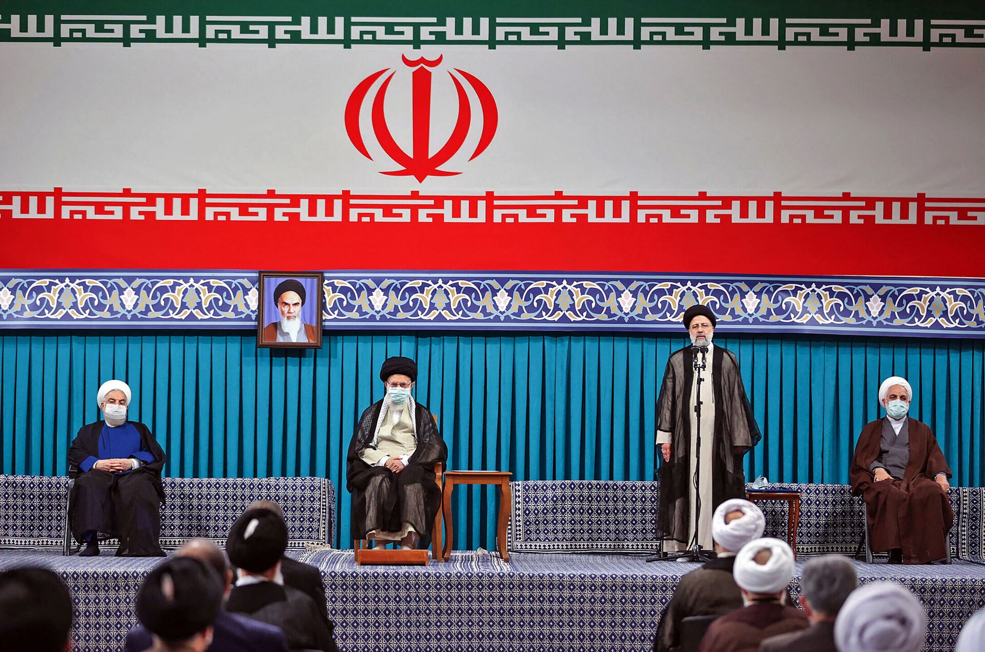 A handout picture provided by the office of Iran's Supreme Leader Ayatollah Ali Khamenei on August, 3 2021 shows him (C L) flanked by outgoing president Hassan Rouhani (L) during the inauguration ceremony for Ebrahim Raisi (C R) in the presence of the head of judiciary authority Gholamhossein Mohseni-Ejei (R) in Khamenei's office in the capital Tehran. - Sputnik International, 1920, 13.09.2021