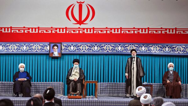 A handout picture provided by the office of Iran's Supreme Leader Ayatollah Ali Khamenei on August, 3 2021 shows him (C L) flanked by outgoing president Hassan Rouhani (L) during the inauguration ceremony for Ebrahim Raisi (C R) in the presence of the head of judiciary authority Gholamhossein Mohseni-Ejei (R) in Khamenei's office in the capital Tehran. - Sputnik International