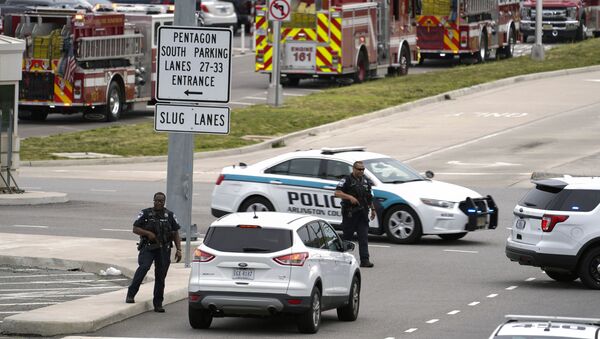 Emergency vehicles are seen outside the Pentagon Metro area Tuesday, 3 August 2021, at the Pentagon in Washington. The Pentagon is on lockdown after multiple gunshots were fired near a platform by the facility's Metro station. - Sputnik International