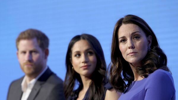 In this Wednesday, Feb. 28, 2018 file photo, Britain's Kate, Duchess of Cambridge, right, with Prince Harry and his fiancee Meghan Markle attend the first annual Royal Foundation Forum in London. - Sputnik International