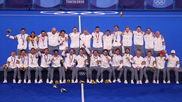 The players and staff of Belgium celebrate as they pose for pictures on the podium after receiving their gold medals.  - Sputnik International