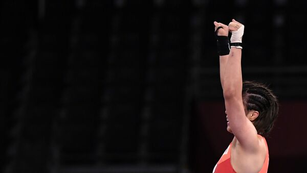 Risako Kawai of Japan celebrates after winning gold against Iryna Kurachkina of Belarus. - Sputnik International