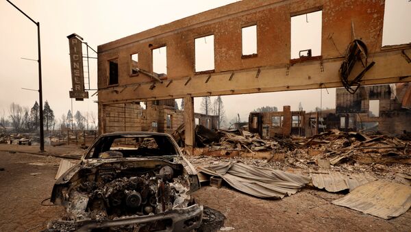 View of a burned out car and commercial building following the Dixie Fire, a wildfire that tore through the town of Greenville, California, U.S. August 5, 2021. - Sputnik International