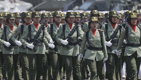 Women soldiers march during a parade marking the 74th anniversary of the Indonesian Armed Forces in Jakarta, Indonesia, Saturday, Oct. 5, 2019.  - Sputnik International