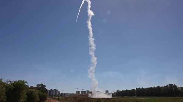 Israel's Iron Dome aerial defence system is launched to intercept rockets launched from the Gaza Strip, above the southern Israeli city of Sderot, on May 18, 2021. - Sputnik International