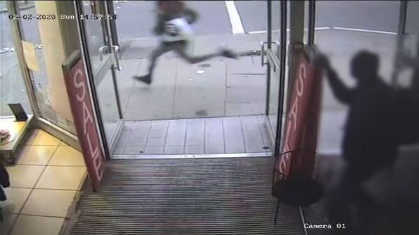 Sudesh Amman, armed with a knife, is seen running along Streatham High Road shortly before being shot by police - Sputnik International